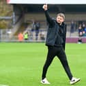Mark Jackson celebrates with the MK Dons supporters following the 2-2 draw with Wycombe Wanderers at Adams Park