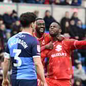 Jonathan Leko celebrates with Mo Eisa after scoring his second goal in as many games for MK Dons