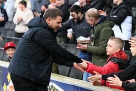Mark Jackson with young fans at Stadium MK
