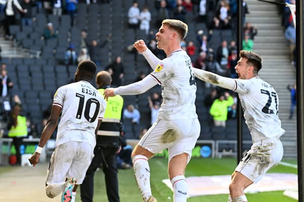 Jack Tucker and Daniel Harvie celebrate Mo Eisa’s equaliser against Portsmouth on Good Friday