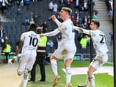 Jack Tucker and Daniel Harvie celebrate Mo Eisa’s equaliser against Portsmouth on Good Friday
