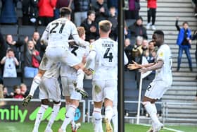 MK Dons take on Cheltenham Town on Saturday looking to make it four home games unbeaten