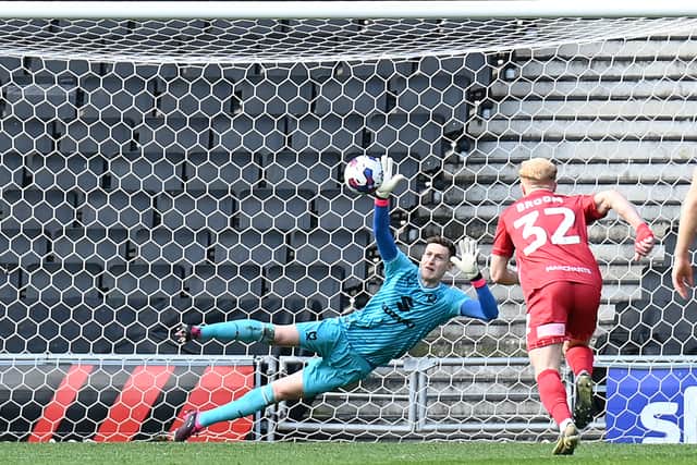 Jamie Cumming did brilliantly to save Alfie May’s second-half penalty