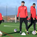 Warren O’Hora has been given the all-clear to return to full-training with MK Dons