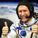 Britain's astronaut Tim Peake gestures as his space suit is tested at the Russian-leased Baikonur cosmodrome (photo: Getty Images)