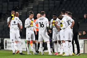MK Dons have three games remaining this season to secure League One status