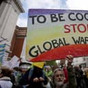 Scientists and science enthusiasts gather prior to the start of the 'March for Science' which celebrates the scientific method outside the Science Museum in central London on April 22, 2017, Earth Day