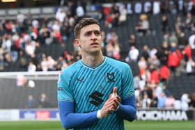 Goalkeeper Jamie Cumming believes he will return to parent club Chelsea a better player for his time with MK Dons