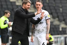 Mark Jackson with MK Dons midfielder Josh McEachran