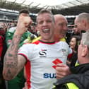 Carl Baker celebrating Dons’ final day promotion in 2015