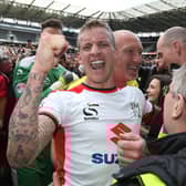 Carl Baker celebrating Dons’ final day promotion in 2015