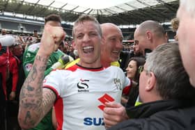 Carl Baker celebrating Dons’ final day promotion in 2015