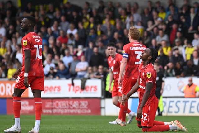 The MK Dons players at the full-time whistle when relegation was confirmed
