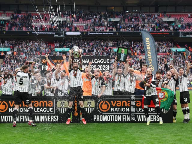 Notts County celebrating their return to the Football League with three former MK Dons in their ranks