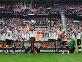 Notts County celebrating their return to the Football League with three former MK Dons in their ranks