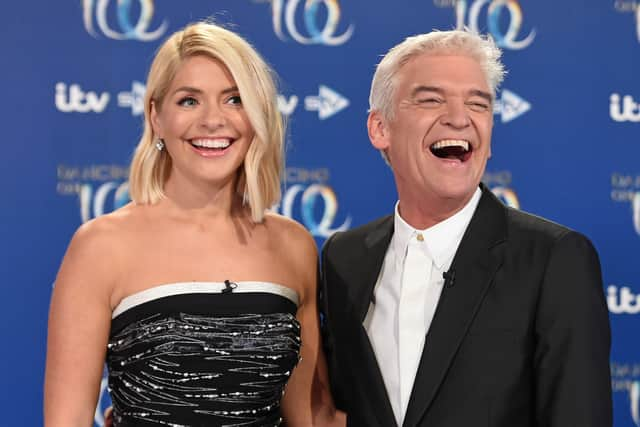 Holly Willoughby (left) and Phillip Schofield (right) put up a united front in Monday's episode of This Morning after rumours of a bitter feud between the hosting duo - Credit: Getty