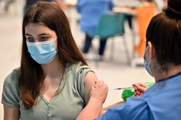 Teenager Katie Moore receives a Covid-19 vaccination in Barrhead, Scotland (Photo: Jeff J Mitchell/Getty Images)