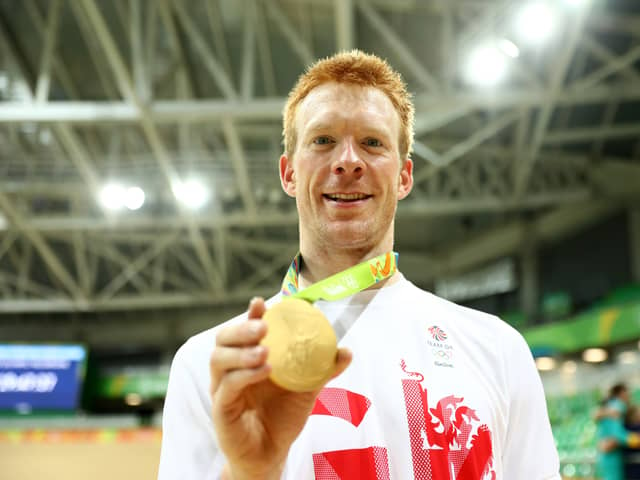 Gold medalist Edward Clancy of Team Great Britain poses for photographs after the medal ceremony for the Men's Team Pursuit on Day 7 of the Rio 2016 Olympic Games (Photo by Bryn Lennon/Getty Images)