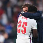 Bukayo Saka is consoled by Gareth Southgate following defeat in the Euro 2020 Championship Final (Photo: Getty Images)
