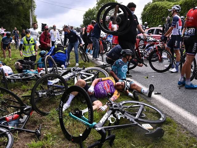 The entire pelaton came crashing down after a spectator reached out into the road with a placard (Photo: Getty Images)
