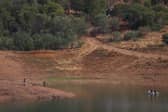 Portuguese firefighterOfficials are seen during a new search operation amid the investigation into the disappearance of Madeleine McCann in the Arade dam, in Silves, near Praia da Luz, on 23 May, 2023.