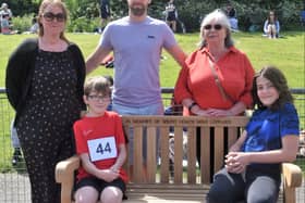 Mike’s family on the new bench at MMKAC