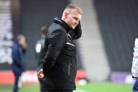 Former Dons boss Liam Manning was the victim of a bit of rough-housing from one of his players on a night out last summer