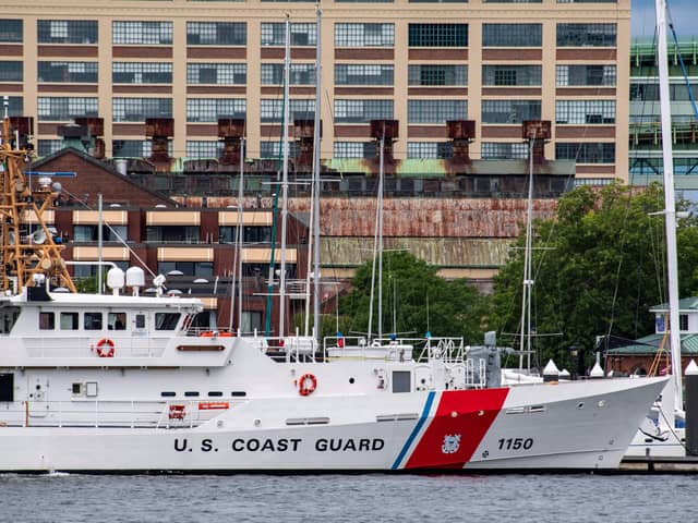 A US Coast Guard vessel sits in port in Boston Harbor across from the US Coast Guard Station Boston in Boston. A submersible vessel used to take tourists to see the wreckage of the Titanic in the North Atlantic has gone missing, triggering a search-and-rescue operation. Credit: Joseph Prezioso/AFP via Getty Images.