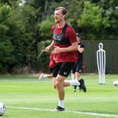 Alex Gilbey returned to pre-season training with MK Dons after re-signing for the club
