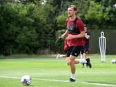 Alex Gilbey returned to pre-season training with MK Dons after re-signing for the club