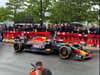 Ricciardo behind the wheel of Red Bull Racing car as part of Baton of Hope’s Milton Keynes tour