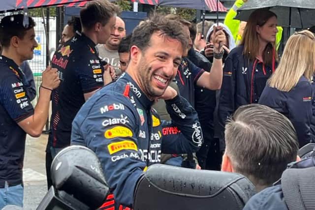 Daniel Ricciardo met members of the Baton’s tour before getting behind the wheel of his Red Bull Racing car 