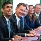 Rishi Sunak and Jeremy Hunt are considering awarding pay rises to certain groups of striking workers. (Photo by STEFAN ROUSSEAU/POOL/AFP via Getty Images)