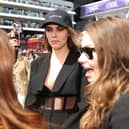 Cara Delevingne has hit back at F1 fans after an awkward encounter with Sky Sports presenter Martin Brundle
