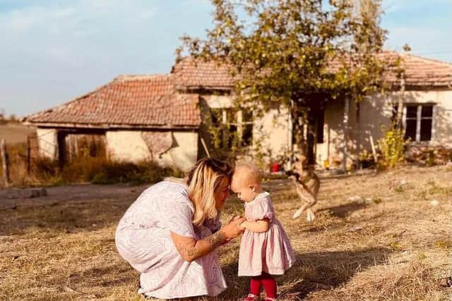 Jordan and Fae Vye outside their farmhouse in Bulgaria.