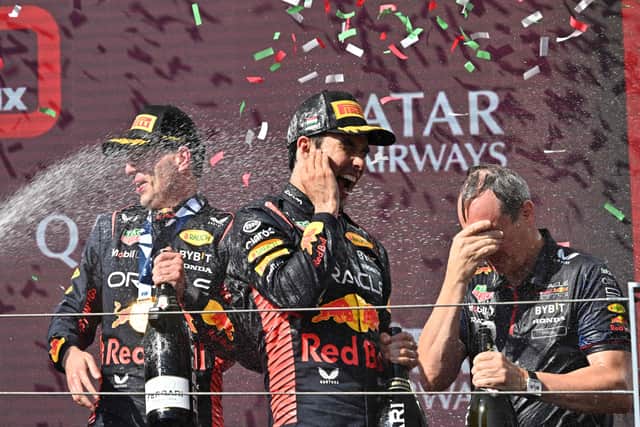 Max Verstappen and Sergio Perez celebrate with chief engineer Paul Monaghan on the podium. Pic: Getty