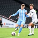 Ethan Robson battles with Coventry’s Josh Eccles during the Sky Blues’ 5-1 win over MK Dons at Stadium MK. Pic: Jane Russell