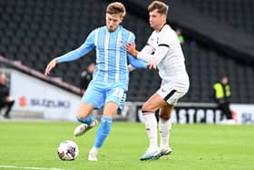 Ethan Robson battles with Coventry’s Josh Eccles during the Sky Blues’ 5-1 win over MK Dons at Stadium MK. Pic: Jane Russell