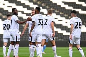 MK Dons celebrate Jonathan Leko’s penalty against Coventry City in their penultimate pre-season game. Pic: Jane Russell