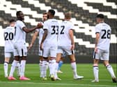 MK Dons celebrate Jonathan Leko’s penalty against Coventry City in their penultimate pre-season game. Pic: Jane Russell