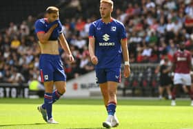 Cameron Norman and Warren O’Hora in pre-season action for MK Dons. Pic: Jane Russell