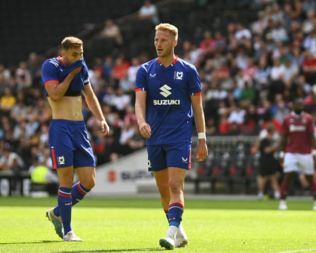 Cameron Norman and Warren O’Hora in pre-season action for MK Dons. Pic: Jane Russell