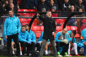 MK Dons’ management team Graham Alexander and Chris Lucketti are no strangers to the entertainment spotlight being focused on a club, having worked under it at Salford City. Pic: Getty