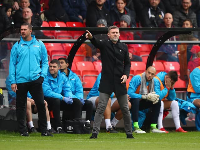 MK Dons’ management team Graham Alexander and Chris Lucketti are no strangers to the entertainment spotlight being focused on a club, having worked under it at Salford City. Pic: Getty