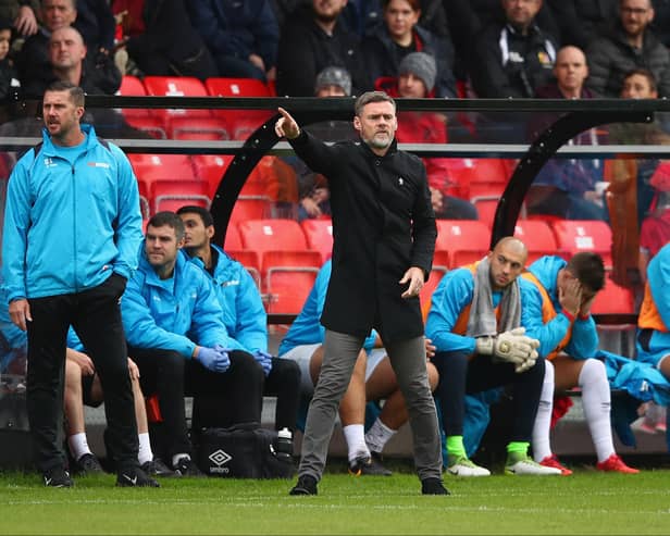 MK Dons’ management team Graham Alexander and Chris Lucketti are no strangers to the entertainment spotlight being focused on a club, having worked under it at Salford City. Pic: Getty