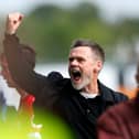 Graham Alexander celebrates MK Dons’ victory away at Wrexham on Saturday. Pic: Getty