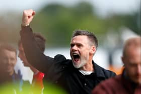 Graham Alexander celebrates MK Dons’ victory away at Wrexham on Saturday. Pic: Getty