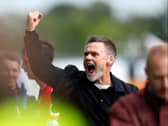 Graham Alexander celebrates MK Dons’ victory away at Wrexham on Saturday. Pic: Getty