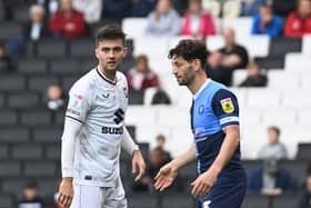 Daniel Harvie and Joe Jacobson during the match between MK Dons and Wycombe Wanderers at Stadium MK last season. Pic: Jane Russell