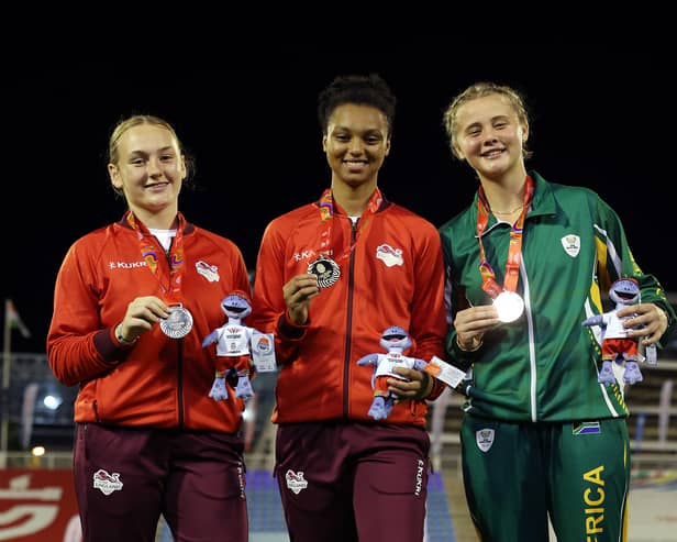 Ayesha Jones celebrates on the podium after a brilliant win in the javelin. Pic: Getty